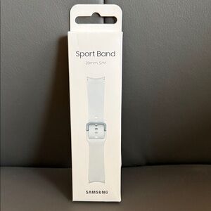 Samsung Sport Band in Soft Gray size S/M. Along with an additional sport band